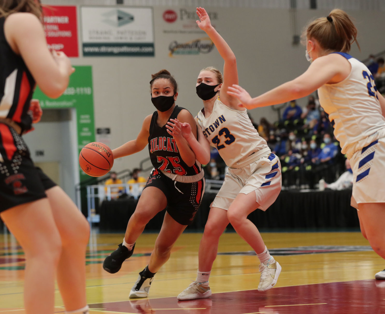 WIAA state girls basketball photo: Verona's Reagan Briggs drives past Germantown's Katie Pampuch